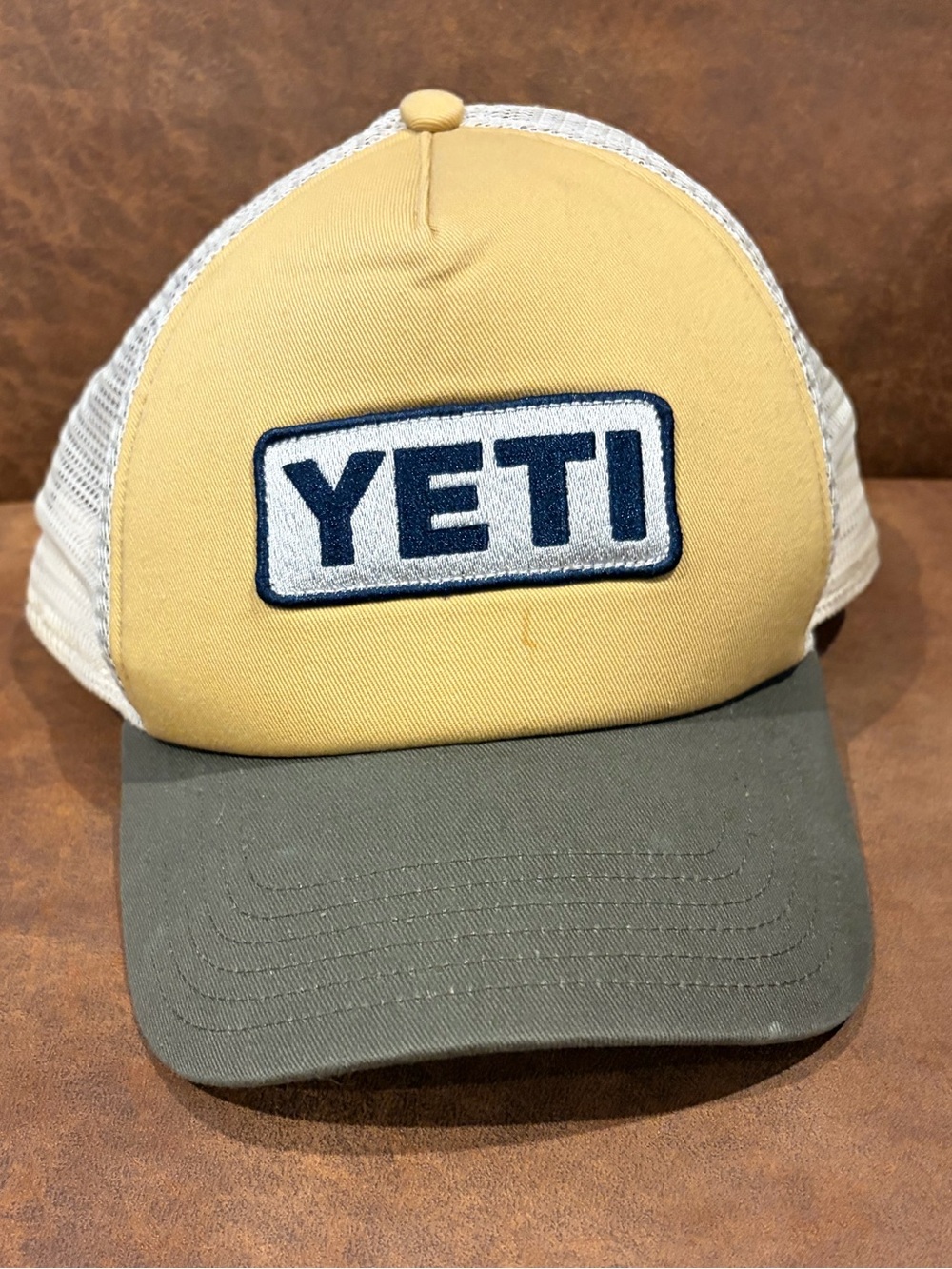 Yeti yellow front panel trucker hat with gray brim